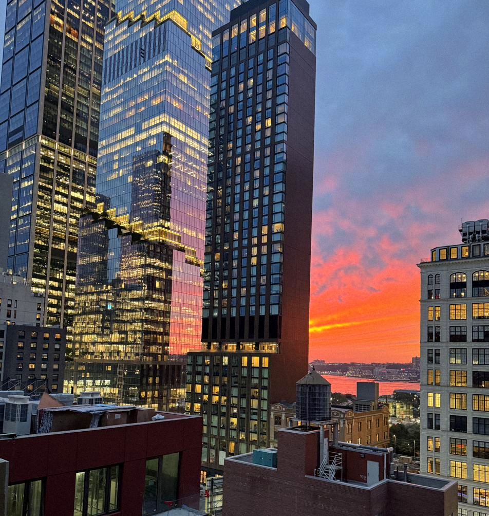 View from the roof at sunset, with the Hudson Yards towers catching the last orange light